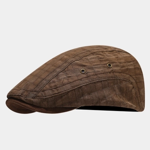 Deep brown quilted ivy cap with vintage metal vents and textured brim for outdoor style