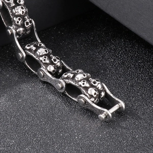 Macro detail of vintage punk skull link chain bracelet in stainless steel finish