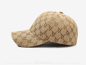Detailed side view of khaki baseball cap featuring jacquard monogram pattern fabric