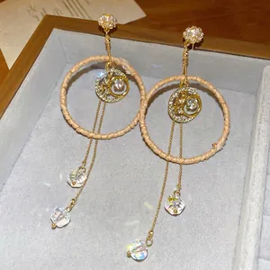 Bohemian rattan circle earrings with golden moon star pendants and crystal tassels