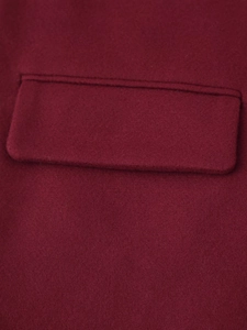 Detailed macro view of the crimson wool pocket stitching and heavy fabric texture