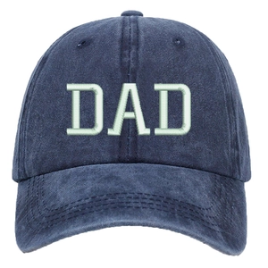 Close-up of DAD 3D embroidery on navy washed cotton baseball cap with detailed stitching