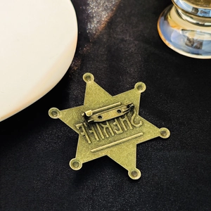 Vintage bronze sheriff star badge brooch with six-point hexagram and metal pin backing