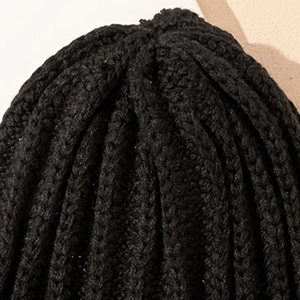 Unisex black chunky knit beanie with rib-knit texture for autumn and winter warmth