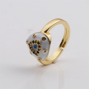Macro view of gold evil eye ring with blue enamel and colorful zircon micro-inlay