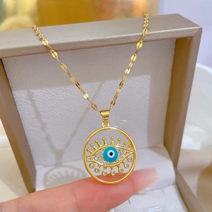 Golden titanium steel necklace with luxury evil eye pendant and sparkling rhinestones