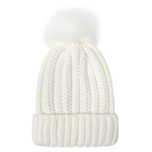 Close-up of a white knit beanie featuring thick texture and a fluffy faux fur pom-pom