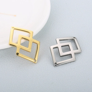 Minimalist interlocking hollow diamond pendant in polished gold and silver stainless steel