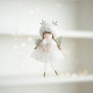Close-up of white plush Christmas angel with silver antlers and mesh star dress hanging