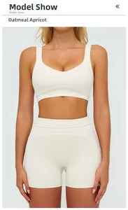 Detailed close-up of oat beige high-waist fitness shorts and sports bra with visible seams