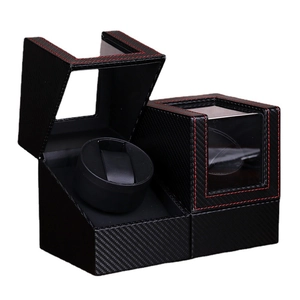Dual automatic watch winder box in black carbon fiber leather with red stitching detail