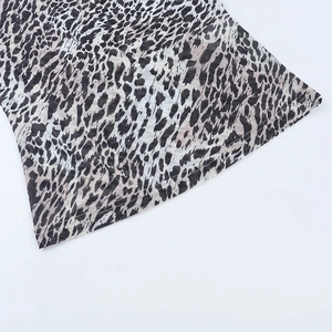 Close-up of leopard print mesh fabric with high-quality double-stitched hem and seams