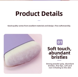 Detailed view of flat-head blush brush with purple matte handle and soft synthetic bristles