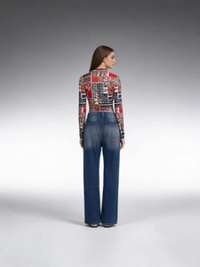 Women's high waist wide leg jeans with washed distressed details and colorful print top