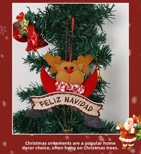Close-up of reindeer Christmas ornament with Feliz Navidad banner on a tree branch