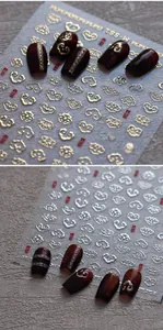Macro detail of M-881 Chinese auspicious cloud nail art stickers in gold and silver finish