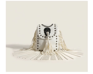 Close-up of white crossbody phone bag with long fringe tassels and rivet studs detail
