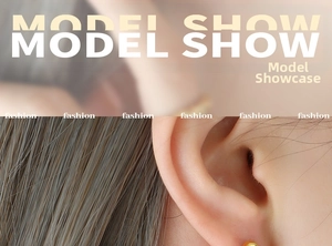 Close-up of minimalist golden spherical stud earrings worn on the ear model show