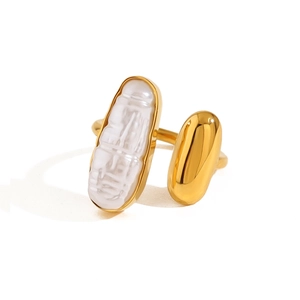 Minimalist adjustable gold ring featuring an irregular baroque pearl and polished metal bead