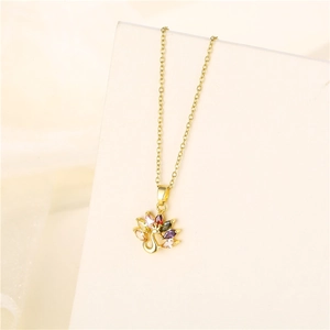 Golden peacock pendant necklace with vibrant multi-color zircon crystals on a fine chain