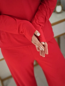 Close-up of soft red long-sleeve pajama set cuff showing premium fabric texture