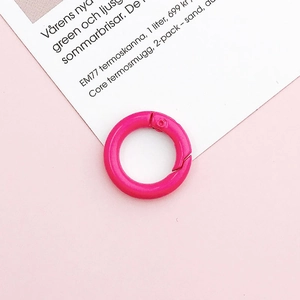 Macro shot of bright pink 20mm round spring ring buckle for DIY accessory and keychains
