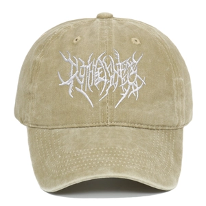 Detail of vintage washed khaki baseball cap with white heavy metal gothic embroidery