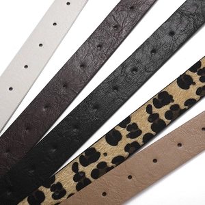 Five assorted leopard print and lychee texture faux leather belts for women displayed together