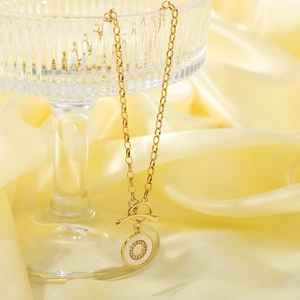 Elegant gold-tone stainless steel OT toggle necklace with sparkling zircon pendant