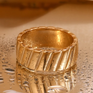 Macro shot of 18K gold plated textured ring featuring luxury water drops decoration