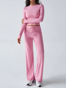 Detailed view of women pink Y2K long sleeve top and matching drawstring wide leg trousers