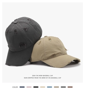 Close-up of distressed vintage cotton baseball caps with trendy ripped details and worn fabric