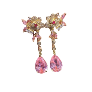 Floral dangle earrings with pink pear-shaped gemstones and white zircon in gold setting