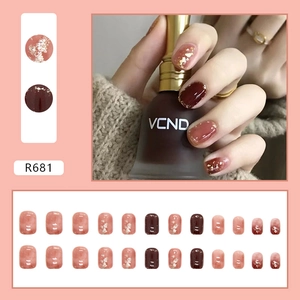 Glossy translucent red pumpkin press-on nails with gold foil accents and rose pink gradients