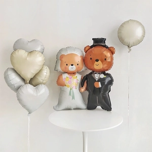 Detailed wedding bear foil balloon set with heart-shaped decor on a white table