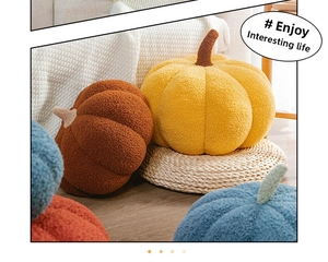 Detail showing plush teddy velvet fabric texture on creative pumpkin-shaped decorative pillows