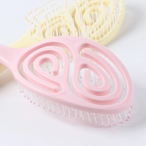 Vented detangling hairbrush set in pink and yellow for styling and head massage