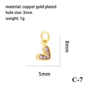 Detailed view of 18K gold plated heart pendant with purple zircon and dimension markers
