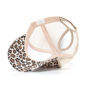 Detail of leopard print ponytail mesh cap showing interior washing label and stitching