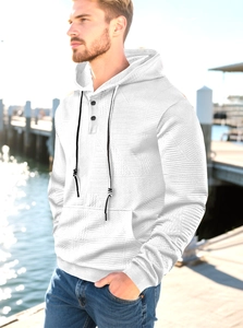 Detail view of white waffle knit hoodie with black drawstrings and button neckline