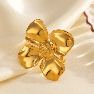Exaggerated 18K gold plated stainless steel oversized flower ring on beige silk