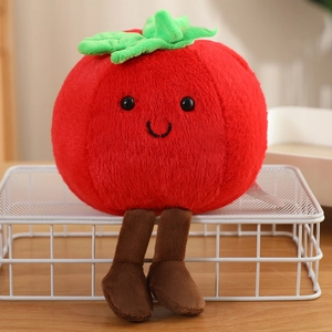 Close-up of a cute plush tomato with dangling legs and a friendly face on a white rack