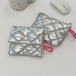 Silver quilted heart clutch pouch with pink drawstring detail and metallic finish