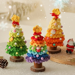 Handmade crochet Christmas tree tabletop ornaments with colorful stars and festive bells