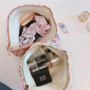Top view of pink jacquard and floral cosmetic bags with large storage capacity