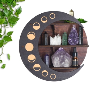 Macro detail of crescent moon wooden shelf featuring lunar phase cutouts and crystal display