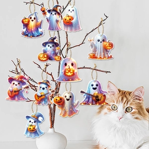 Detail of nine cute Halloween ghost ornaments with pumpkin and guitar hanging on branches
