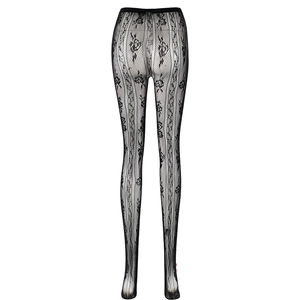Gros plan du motif floral en dentelle noire complexe sur ce legging à étriers tendance