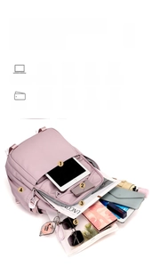 Light pink travel backpack with multiple compartments for tablet and large storage