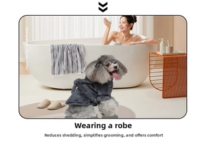 Detail view of dark grey plush dog bathrobe with adjustable waist tie on a toy poodle